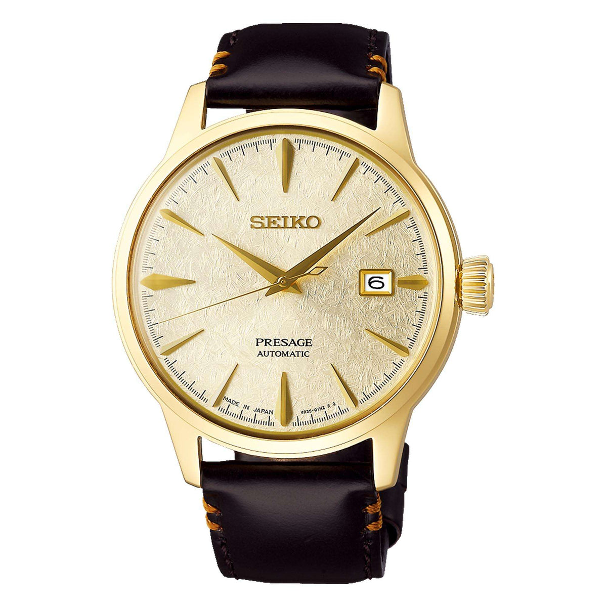 Seiko Presage watch with gold case and brown leather strap on a white background