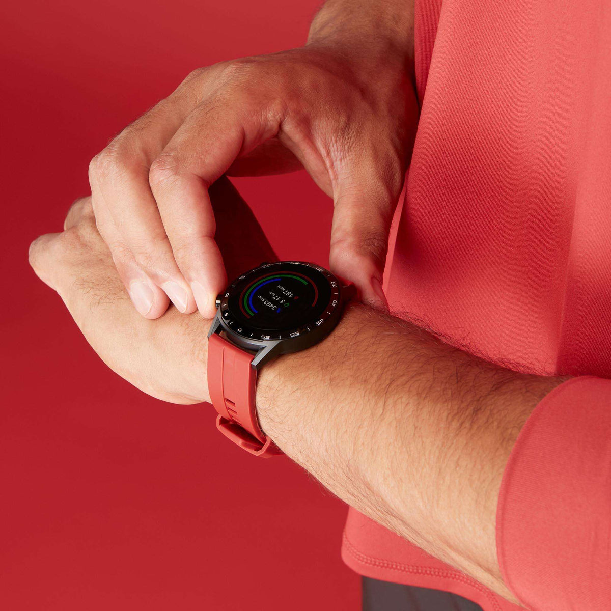 Wrist-worn smart watch with red silicone strap and round black display