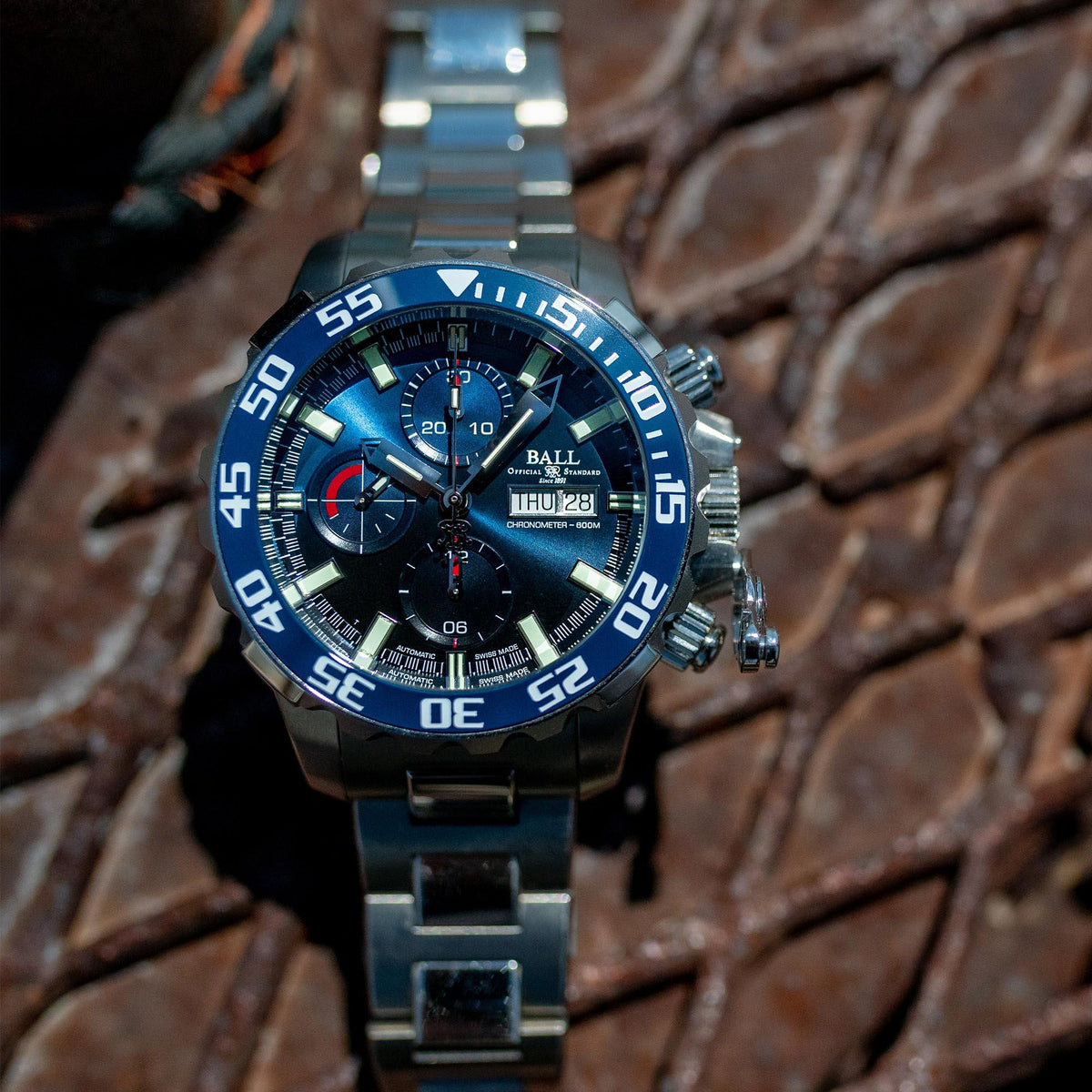 Men's steel automatic chronograph watch with blue dial and metal bracelet