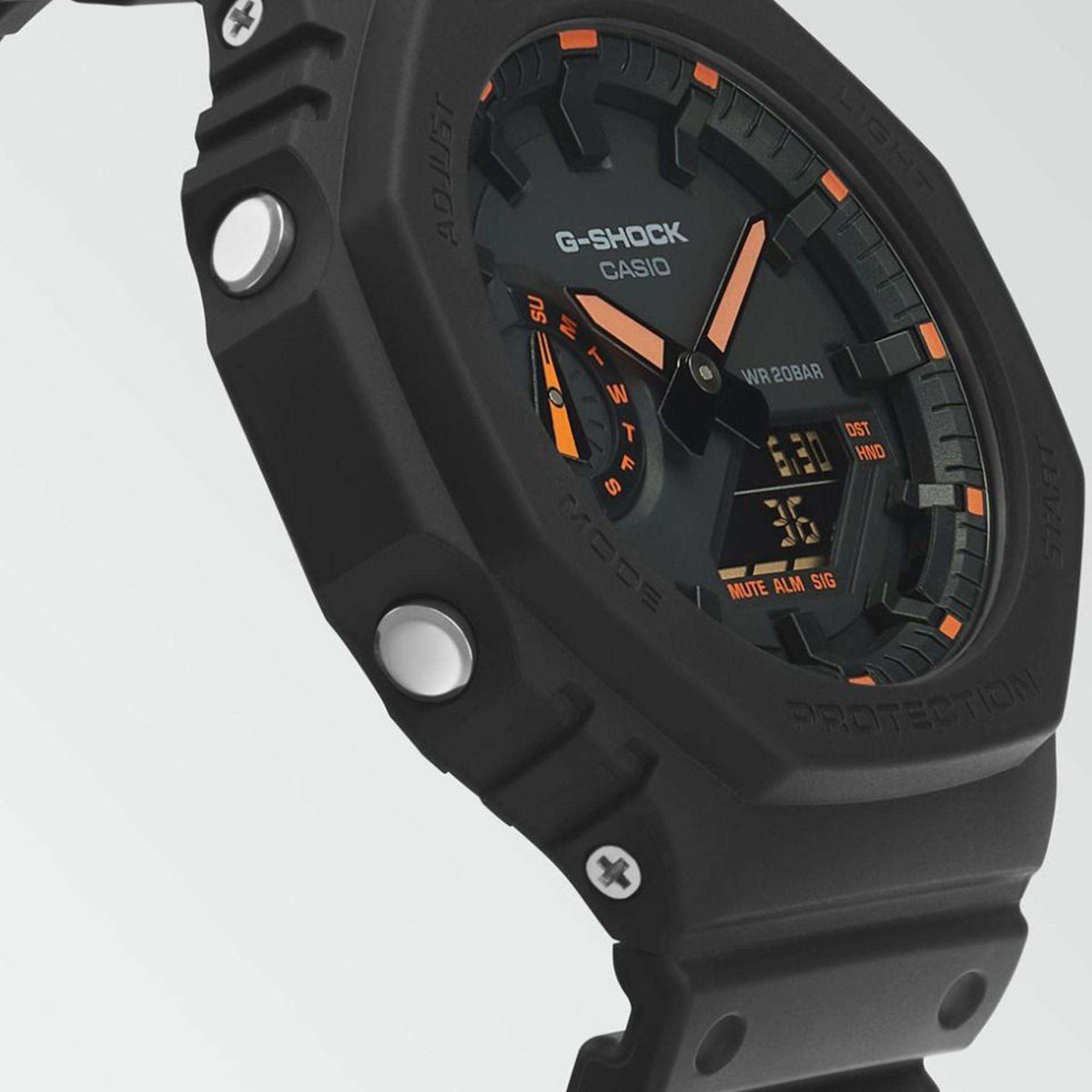 G-Shock watch close-up: dark dial with orange markers on black octagonal case