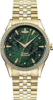 Green dial ladies quartz watch with gold bezel, hands, and gold-tone link bracelet