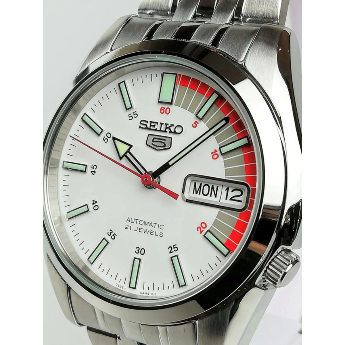 Seiko 5 Automatic SNK369K1 close-up angled view highlighting the polished bezel finish and the crown positioning near 4 o'clock