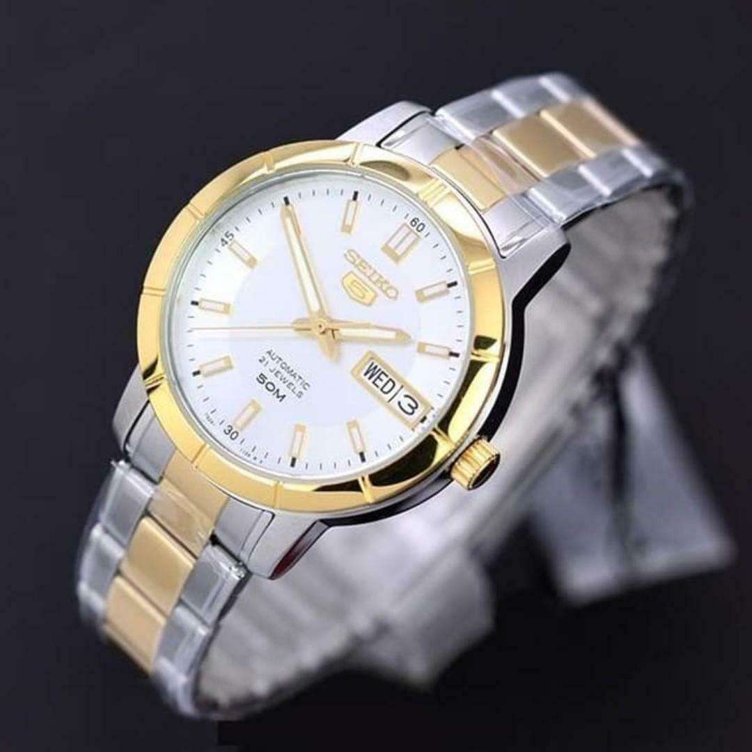 Two-tone Seiko automatic ladies watch with white dial, gold bezel, and date window