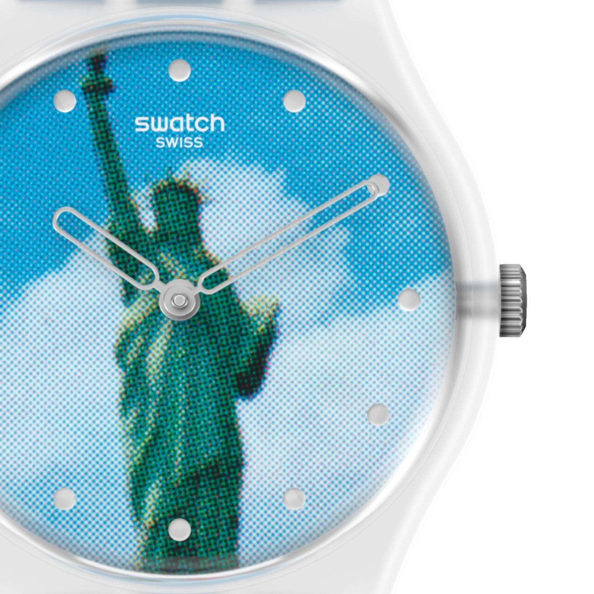 Close-up of blue dial Swatch watch with Statue of Liberty figure and silver hands