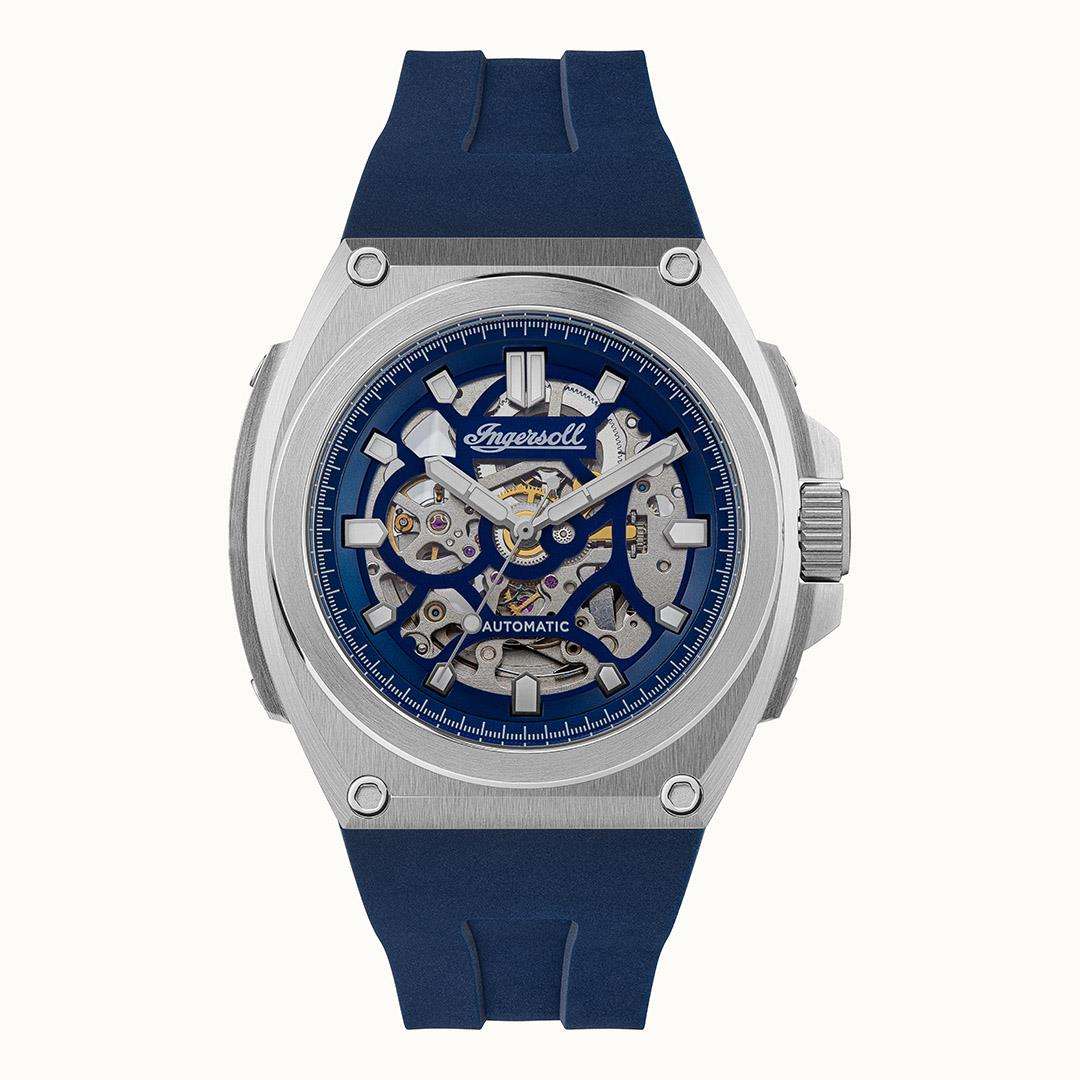 Men's automatic skeleton watch with blue dial, silver case, and blue silicone strap