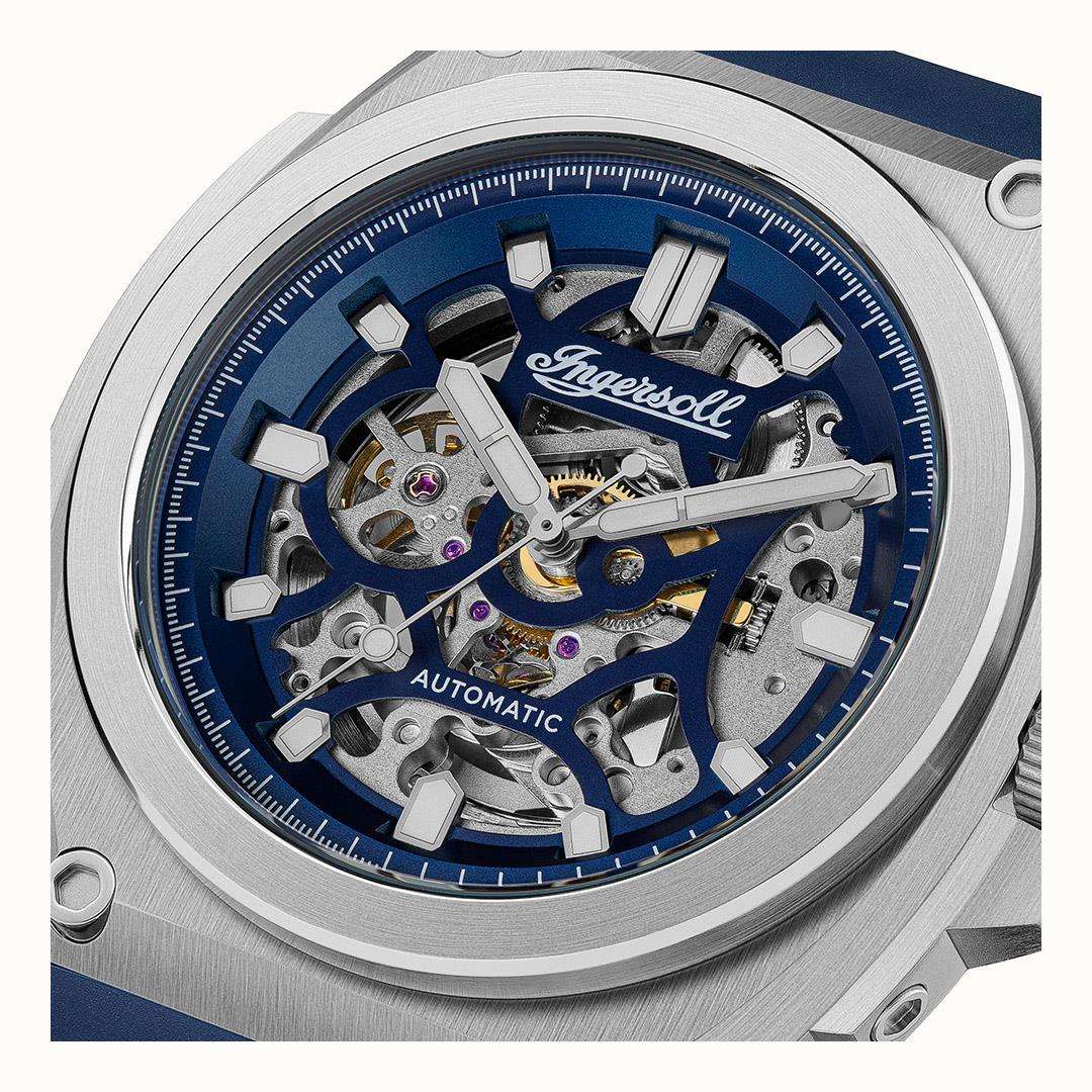 Close-up of blue dial skeleton movement with silver hands and Ingersoll logo