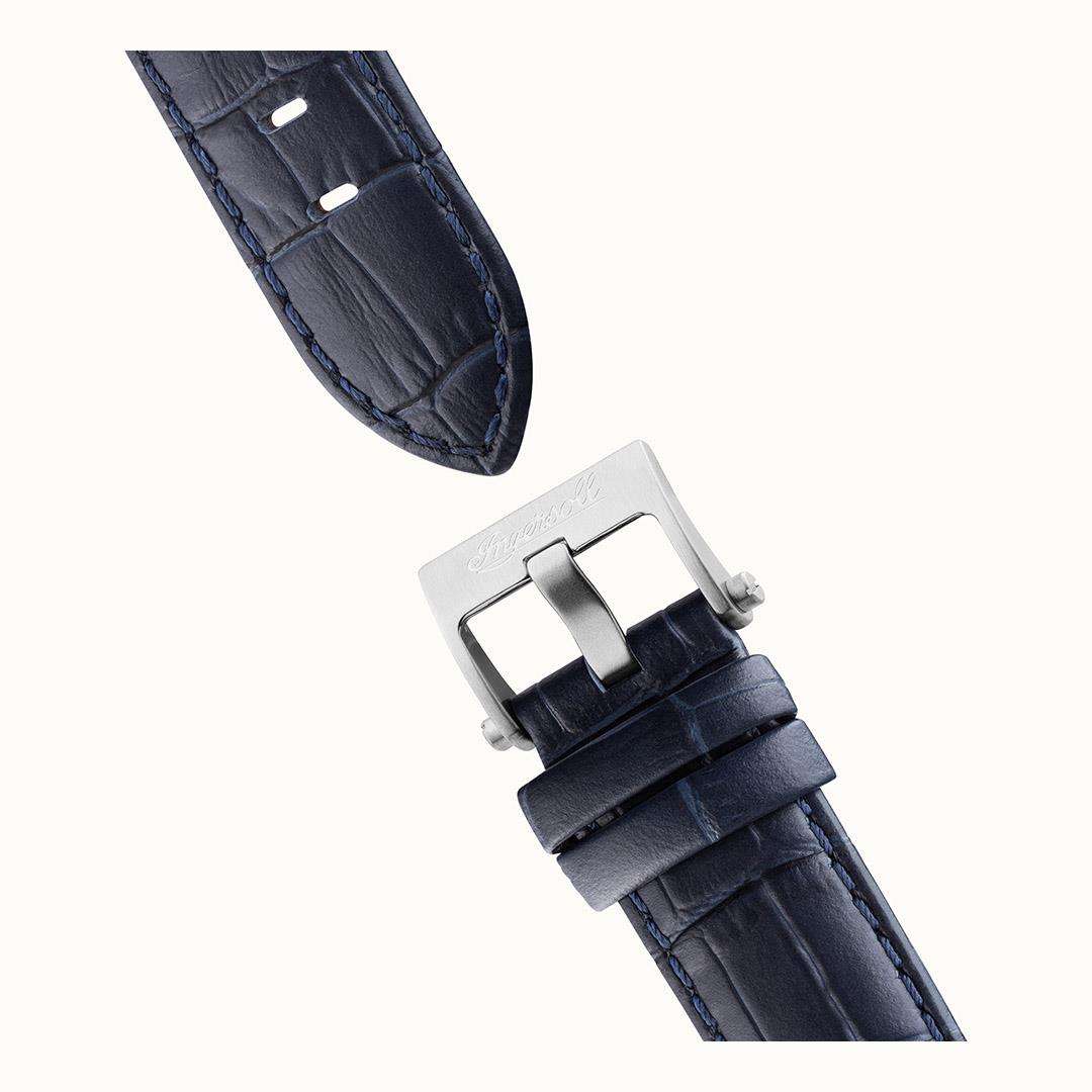 Navy leather watch strap with stitched pattern and metal buckle clasp, shown at an angle.
