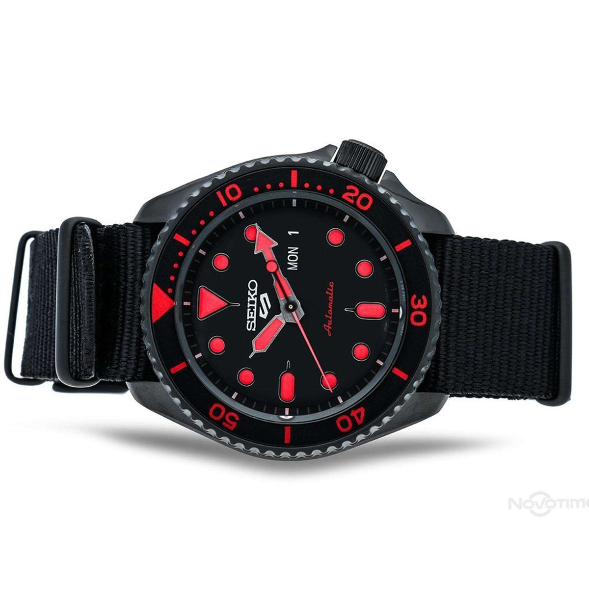Men's Seiko watch with black dial, red bezel numbers, black woven nylon strap