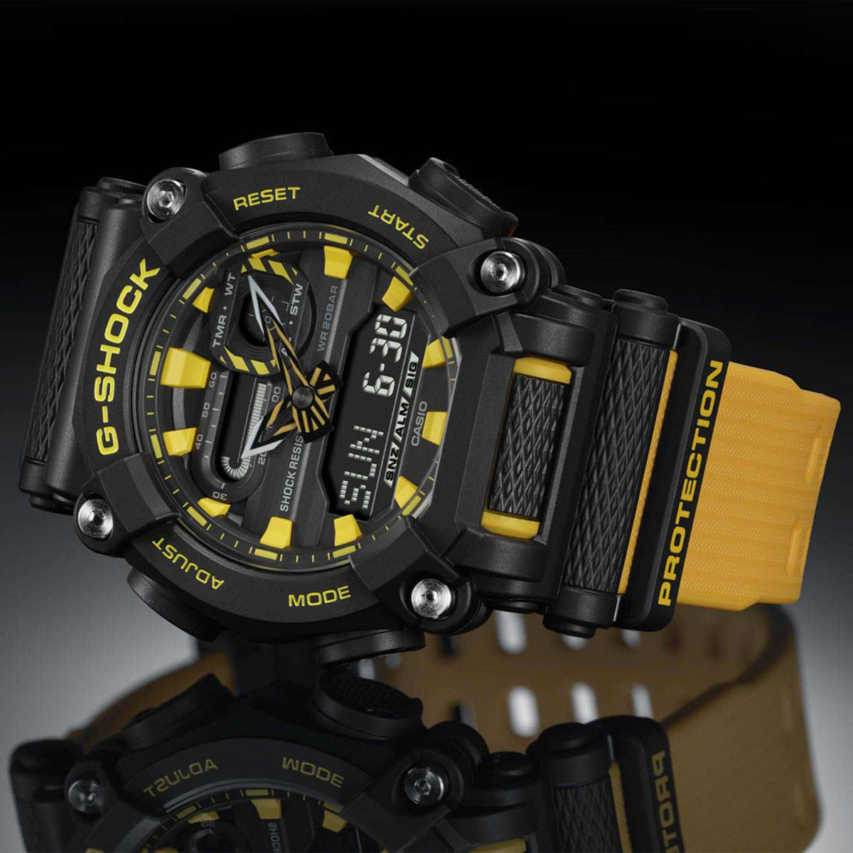 Men's G-Shock watch with black and yellow resin strap, textured case, side buttons and dial view