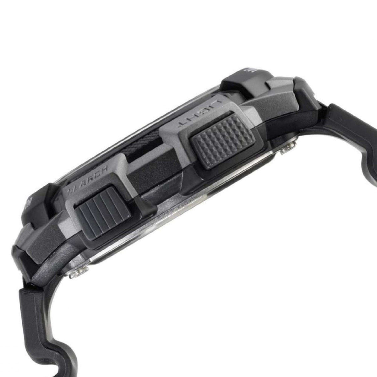 Black resin watch band and side button controls on round digital Casio watch case