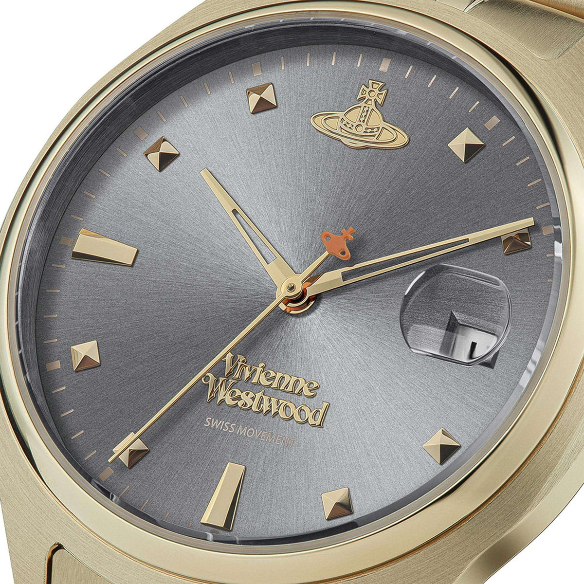 Gold stainless steel watch close-up: gray dial with gold logo and hour markers, orange second hand.
