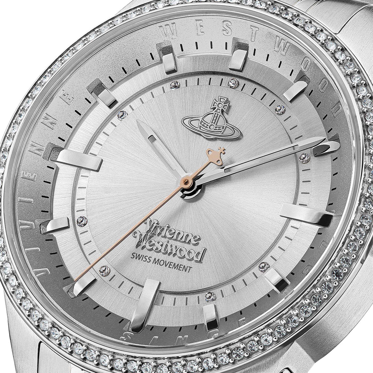 Close-up of ladies stainless steel watch face with white dial, crystal bezel, logo