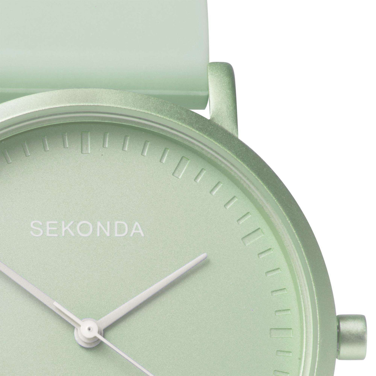 Light green watch case with pale green dial edge, minute markers, and two hands
