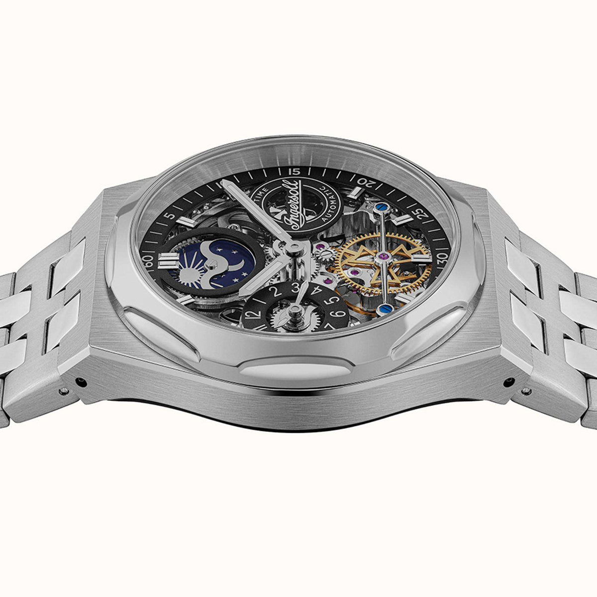 Stainless steel automatic skeleton watch with exposed gears and dials, crown at side, metal bracelet