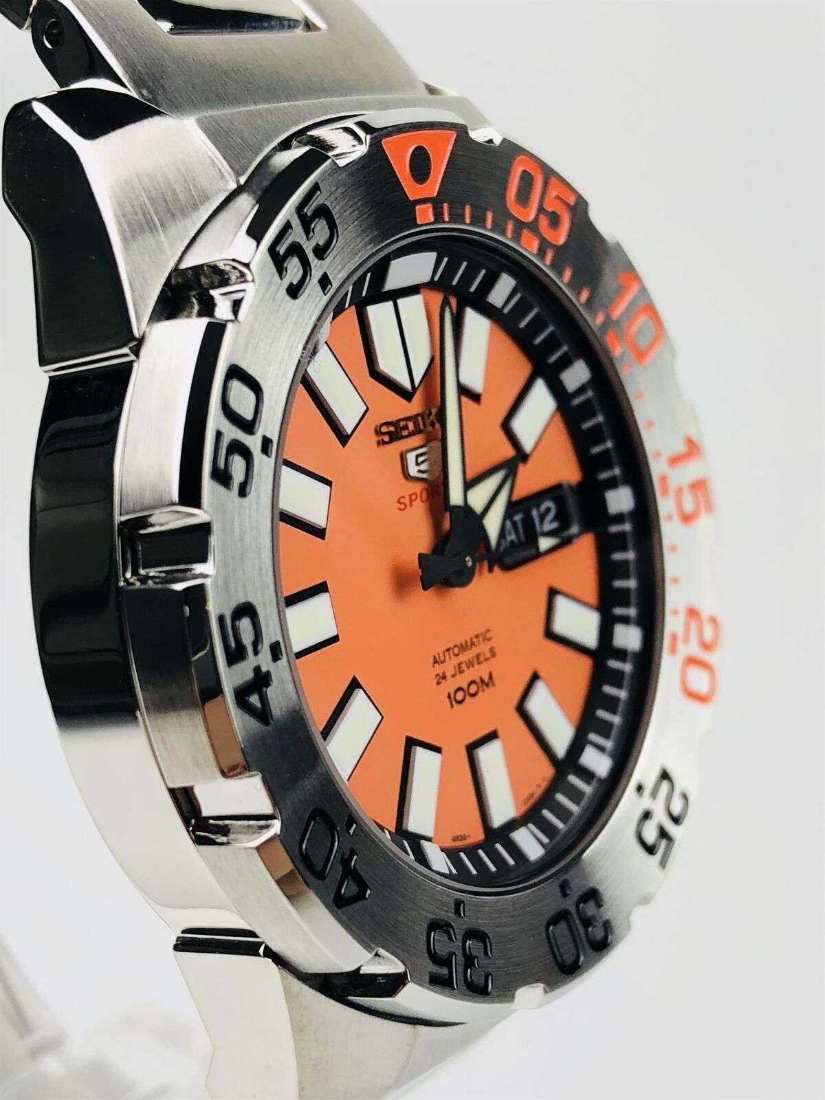 Orange dial stainless steel diver watch with black bezel ring and crown detail