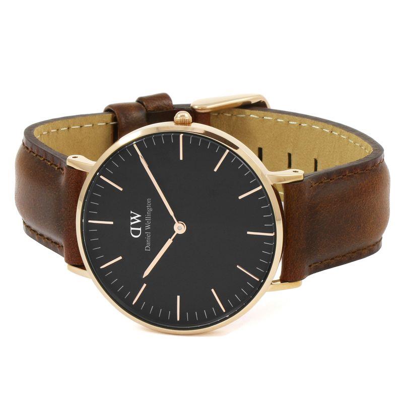 Men's round quartz watch with black dial and brown leather strap, gold-tone bezel