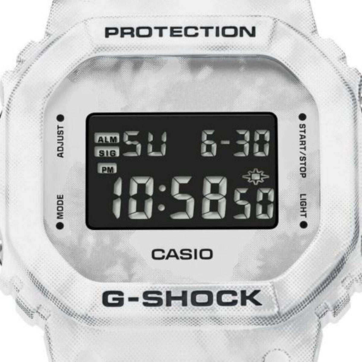 Snow camouflage digital watch close-up showing black LCD time display and buttons