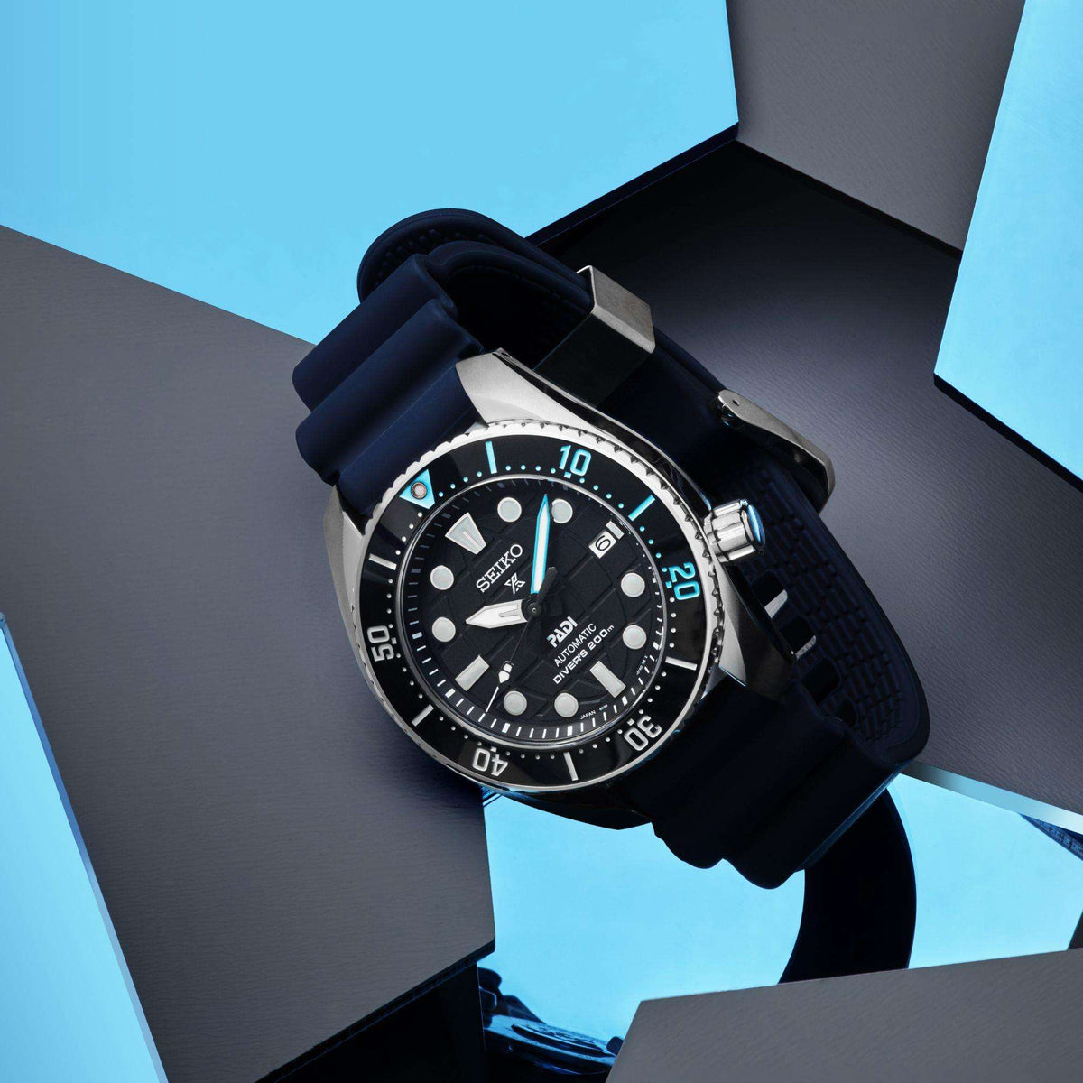 Seiko Prospex dive watch on blue silicone strap with black dial and steel bezel