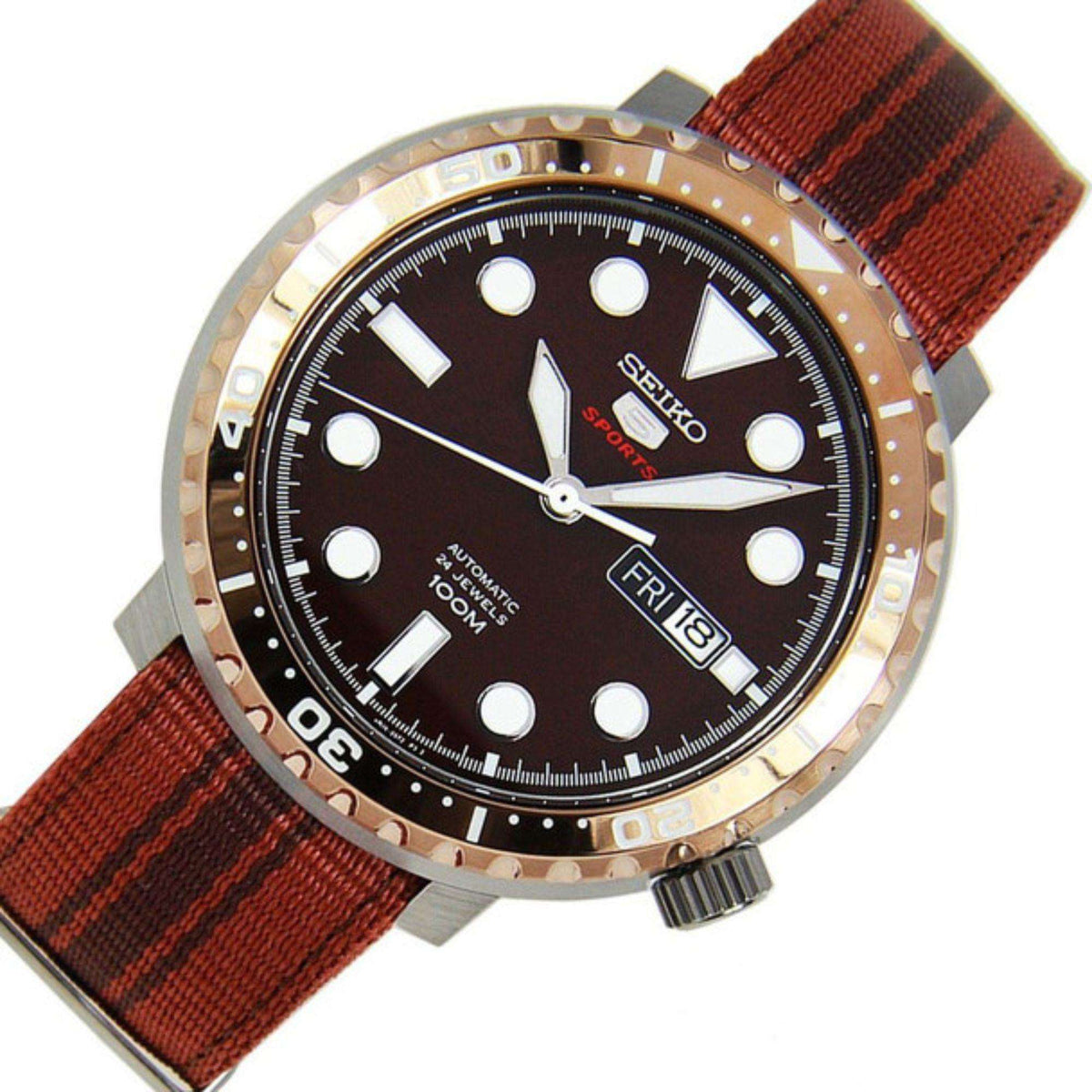 Men's Seiko 5 Sports watch close-up: brown dial, striped brown nylon strap, date window