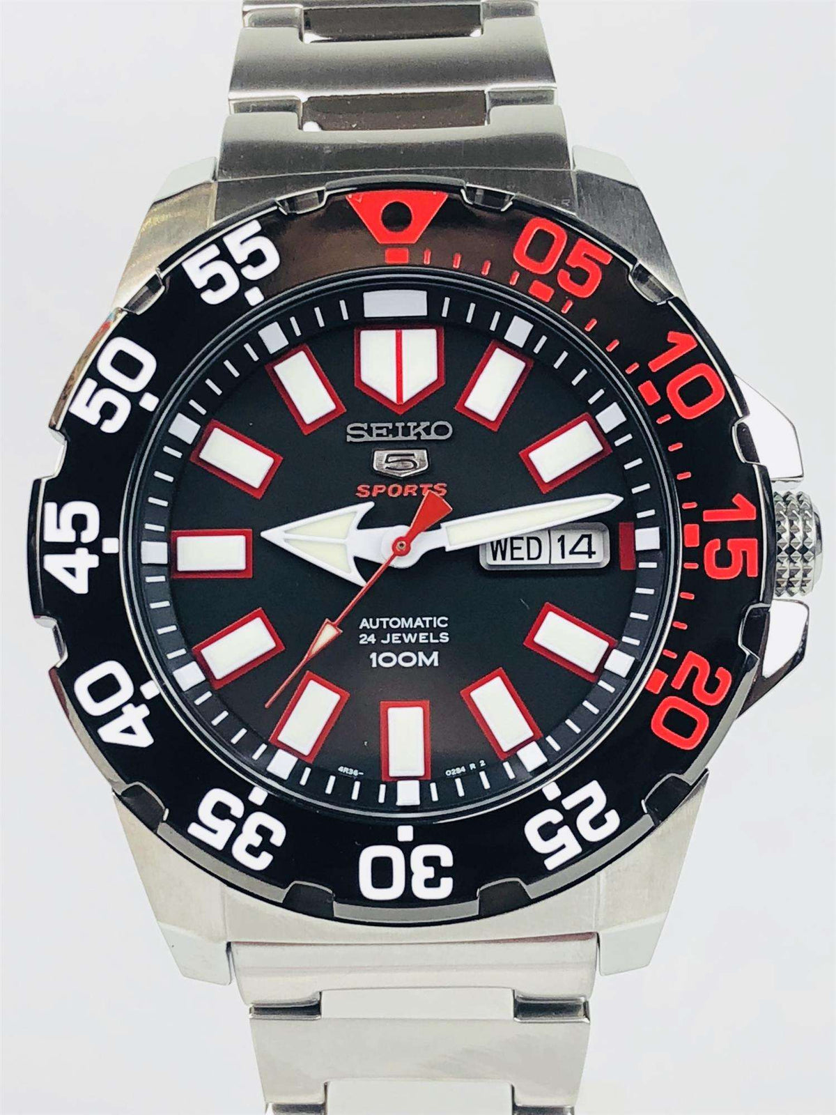 Men's Seiko Sports automatic watch, black dial with red markers and WED14 date window