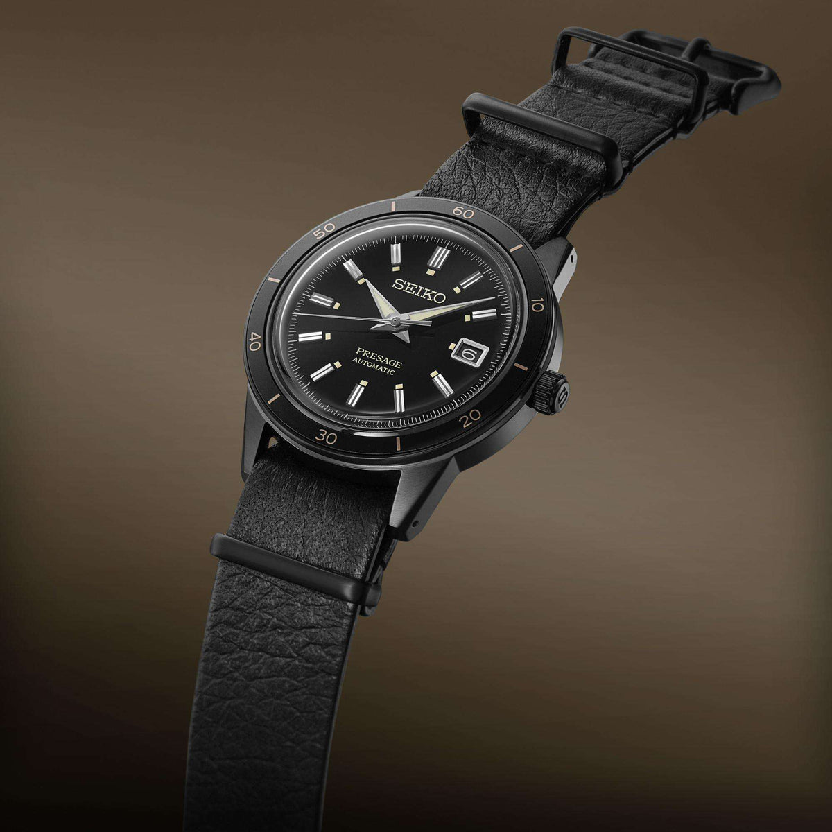 Men's automatic watch with black dial and black leather strap, round case, baton markers