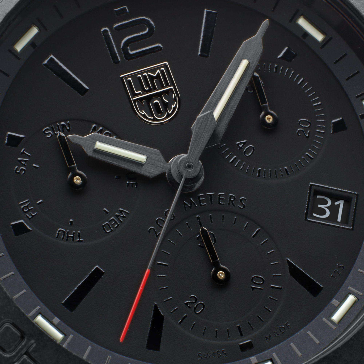 Black chronograph dial diver watch with three subdials and luminous hour markers