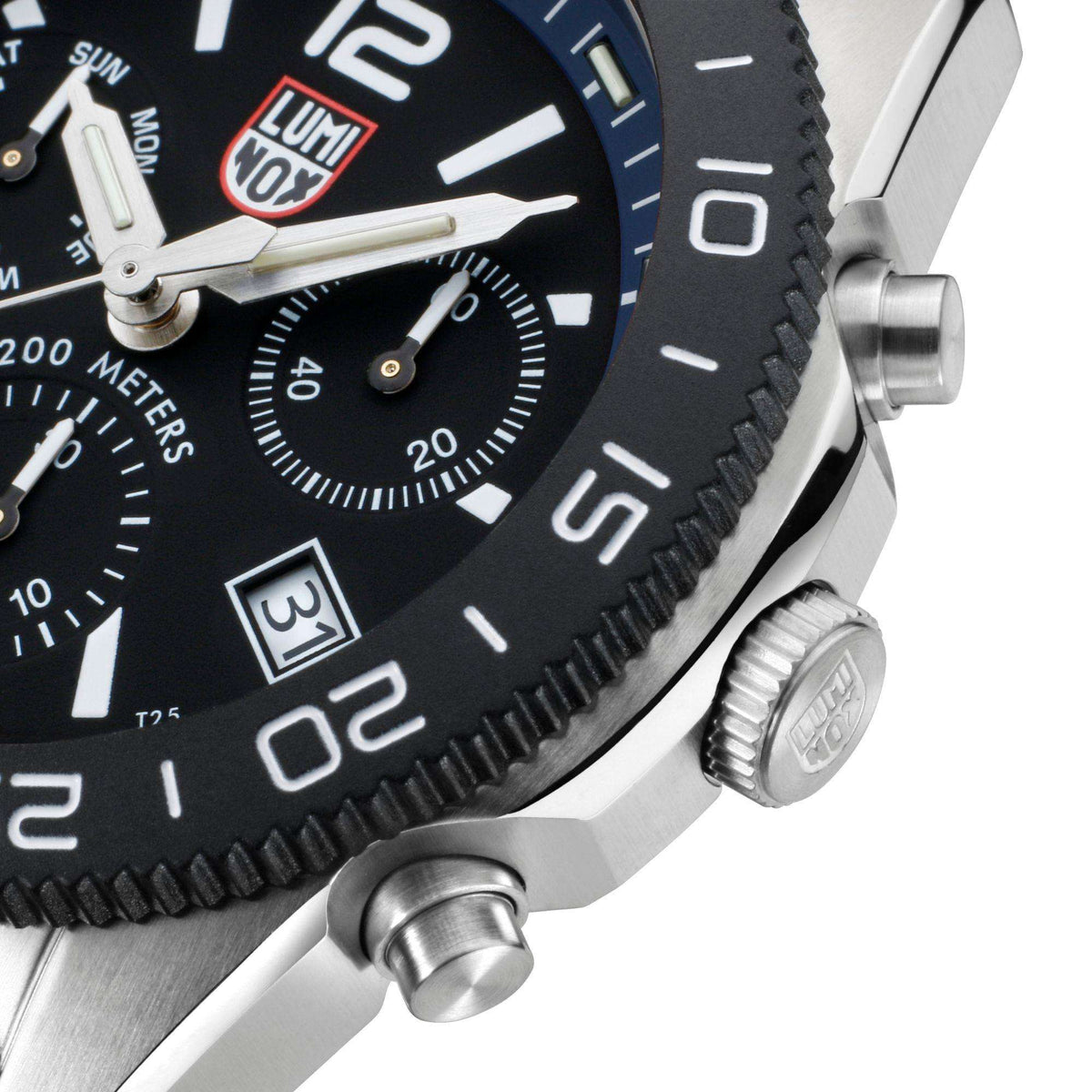 Stainless steel diver watch case with crown and blue rubber strap, black dial detail