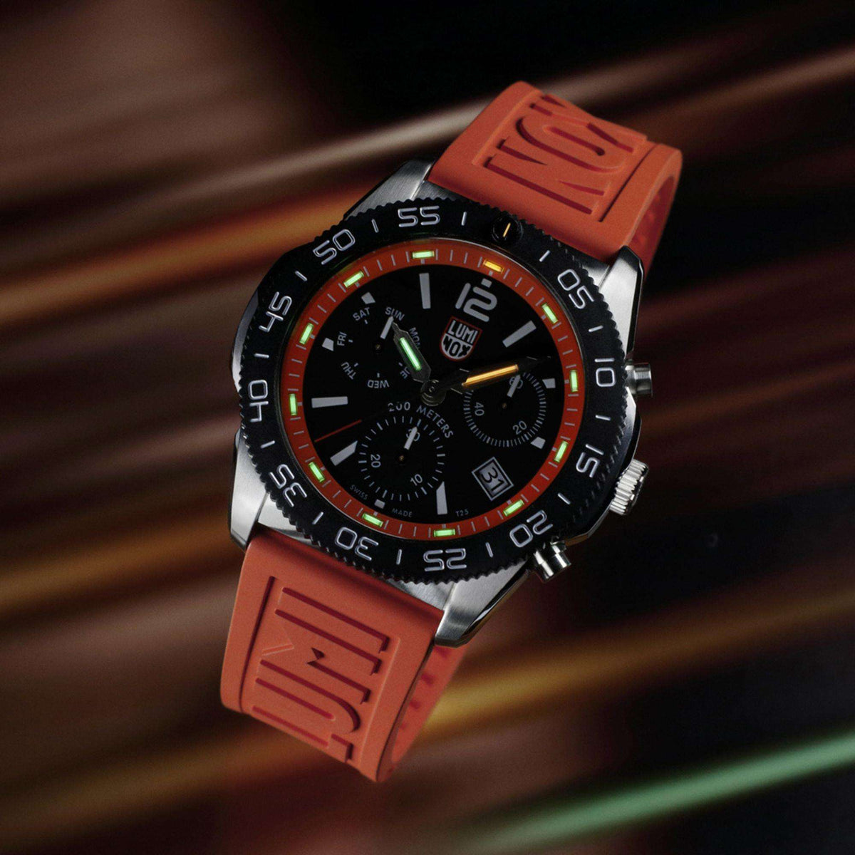 Men's diver chronograph watch with orange rubber strap and black dial with orange bezel ring