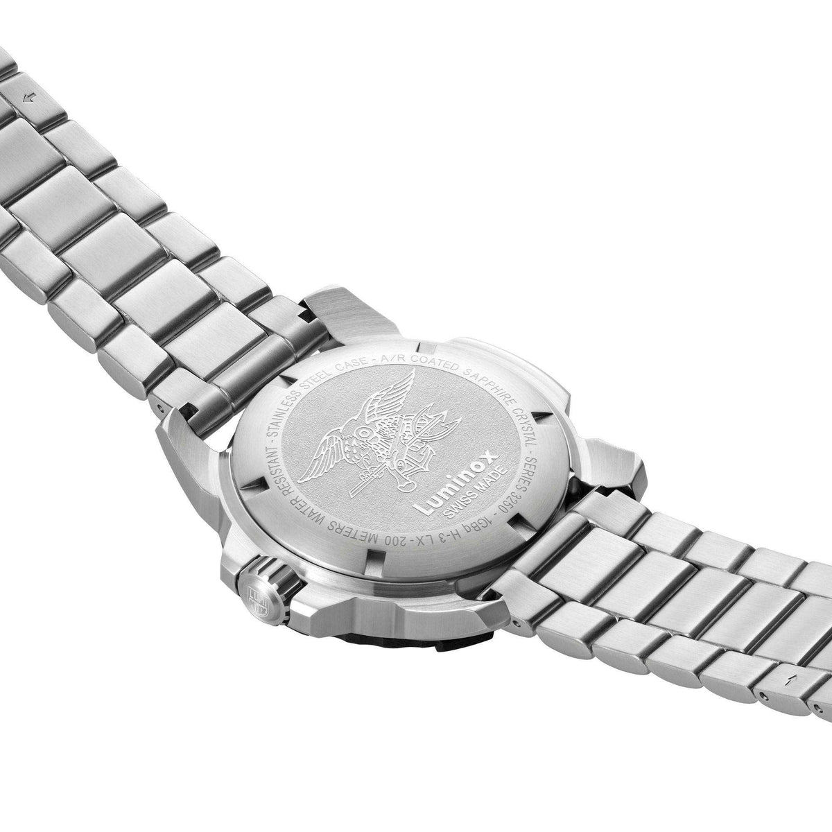 Stainless steel watch caseback with engraved emblem on metal bracelet strap
