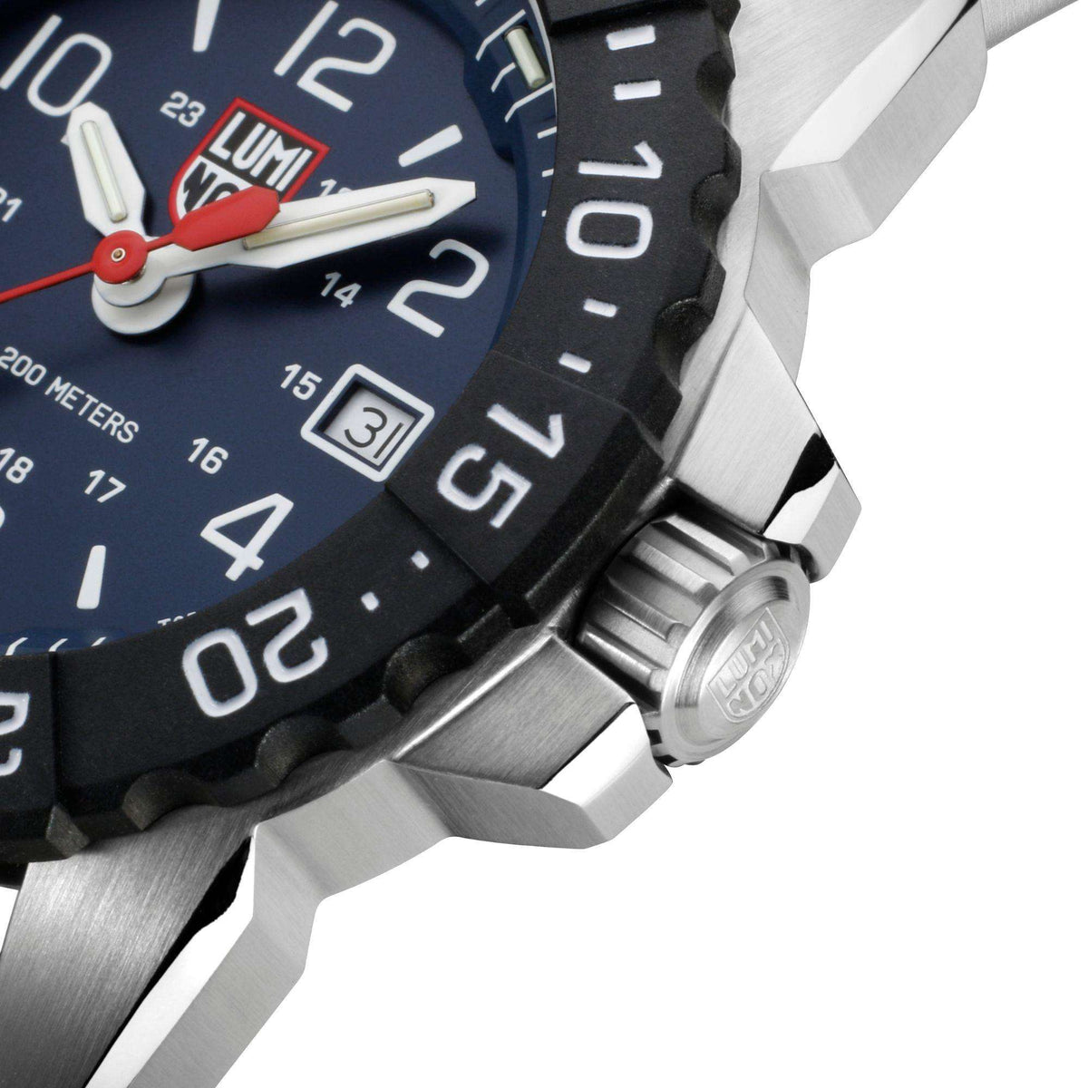 Close-up of dark blue dial and knurled steel crown on stainless steel case