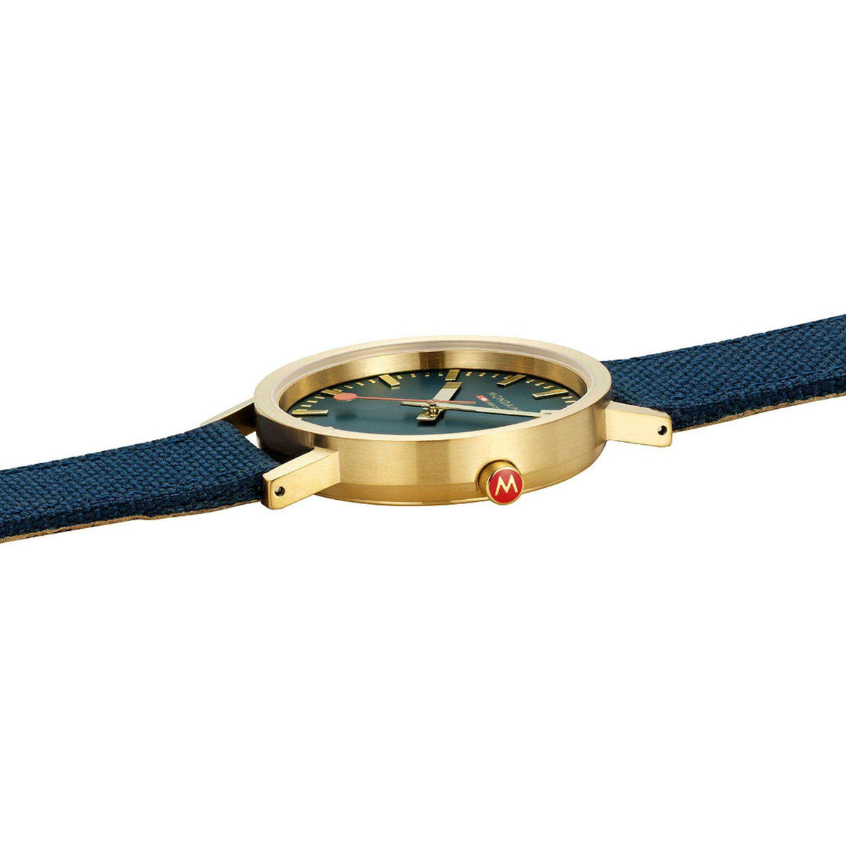 Side view of gold-tone Mondaine watch case on deep ocean blue fabric strap.