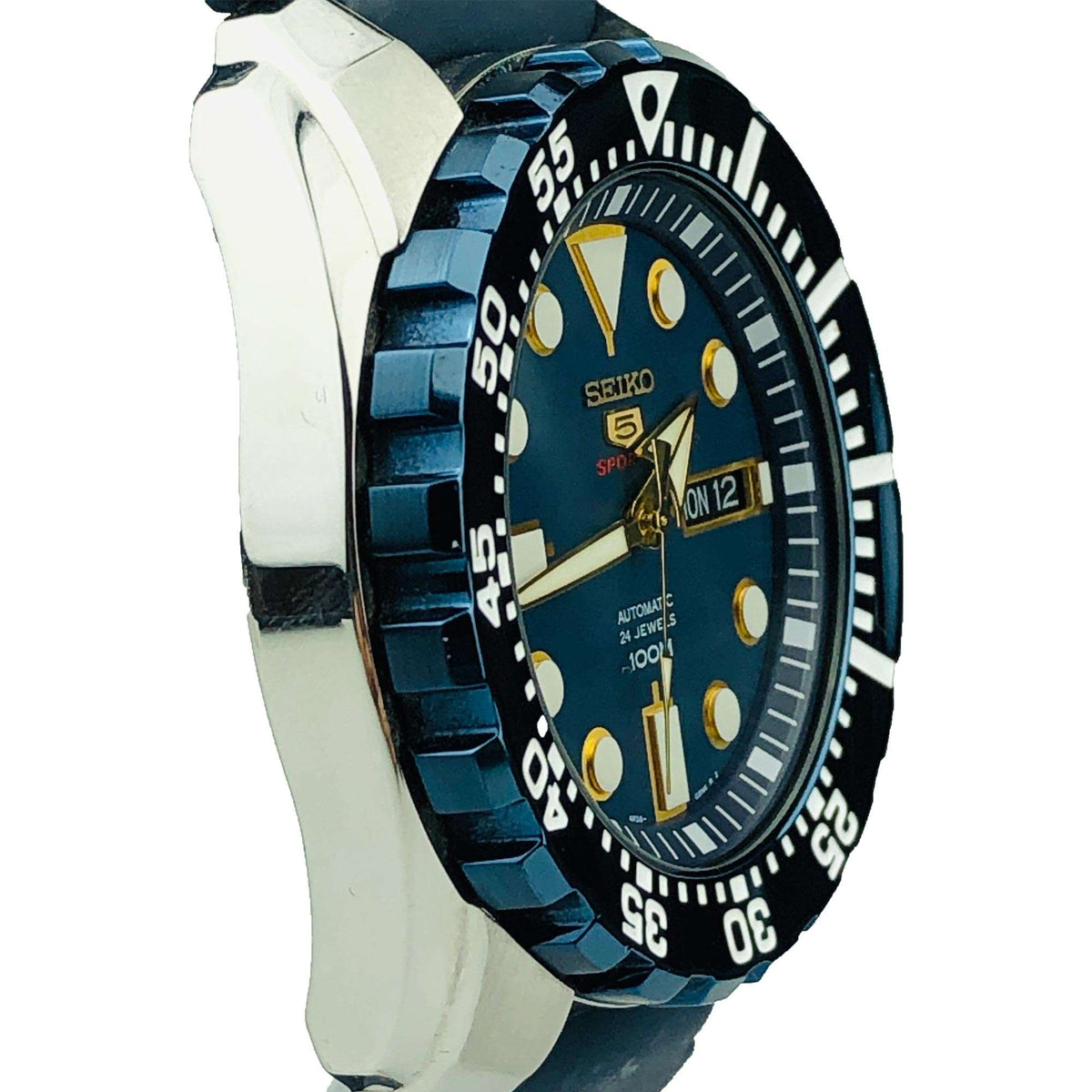 Seiko 5 Sports automatic watch side view with blue silicone strap and silver metal case