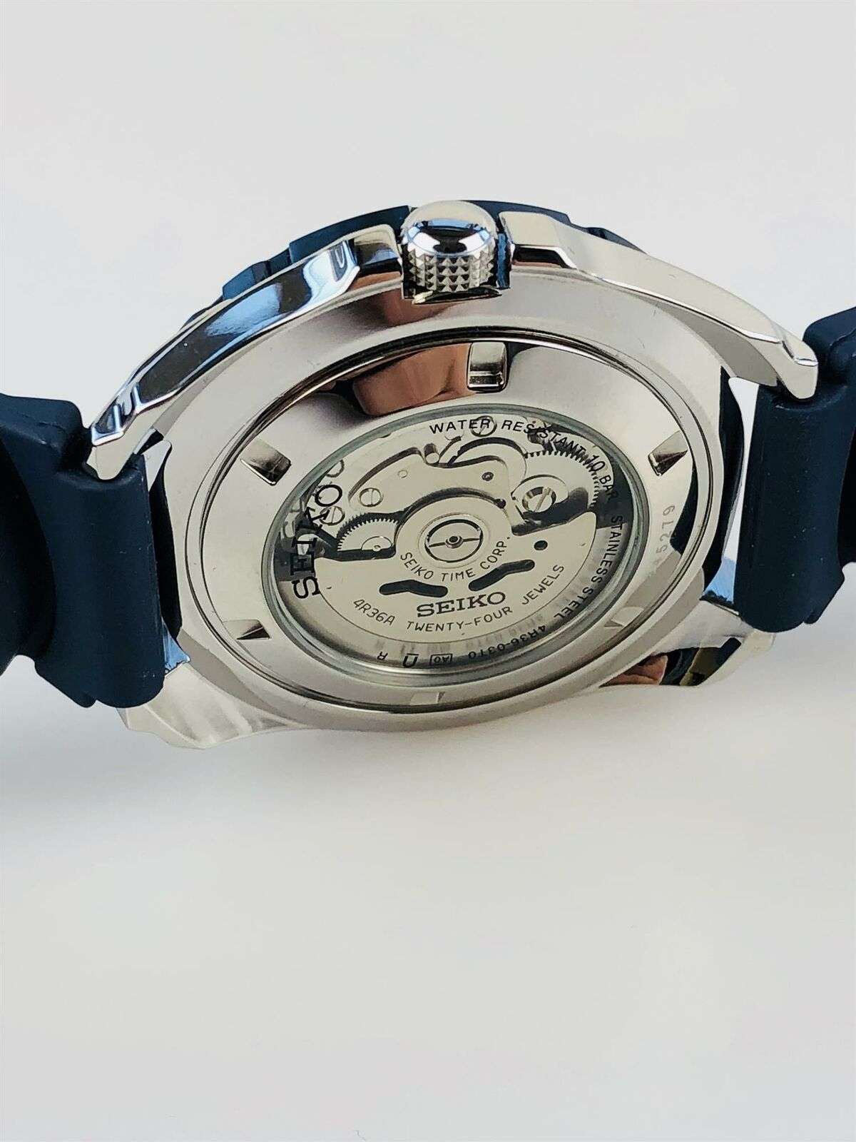 Seiko 5 Sports watch back view with engraved caseback and blue silicone strap