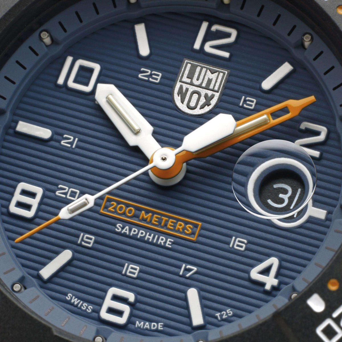 Close-up of Luminox blue dial with luminous markers, date window, orange '200 METERS' label