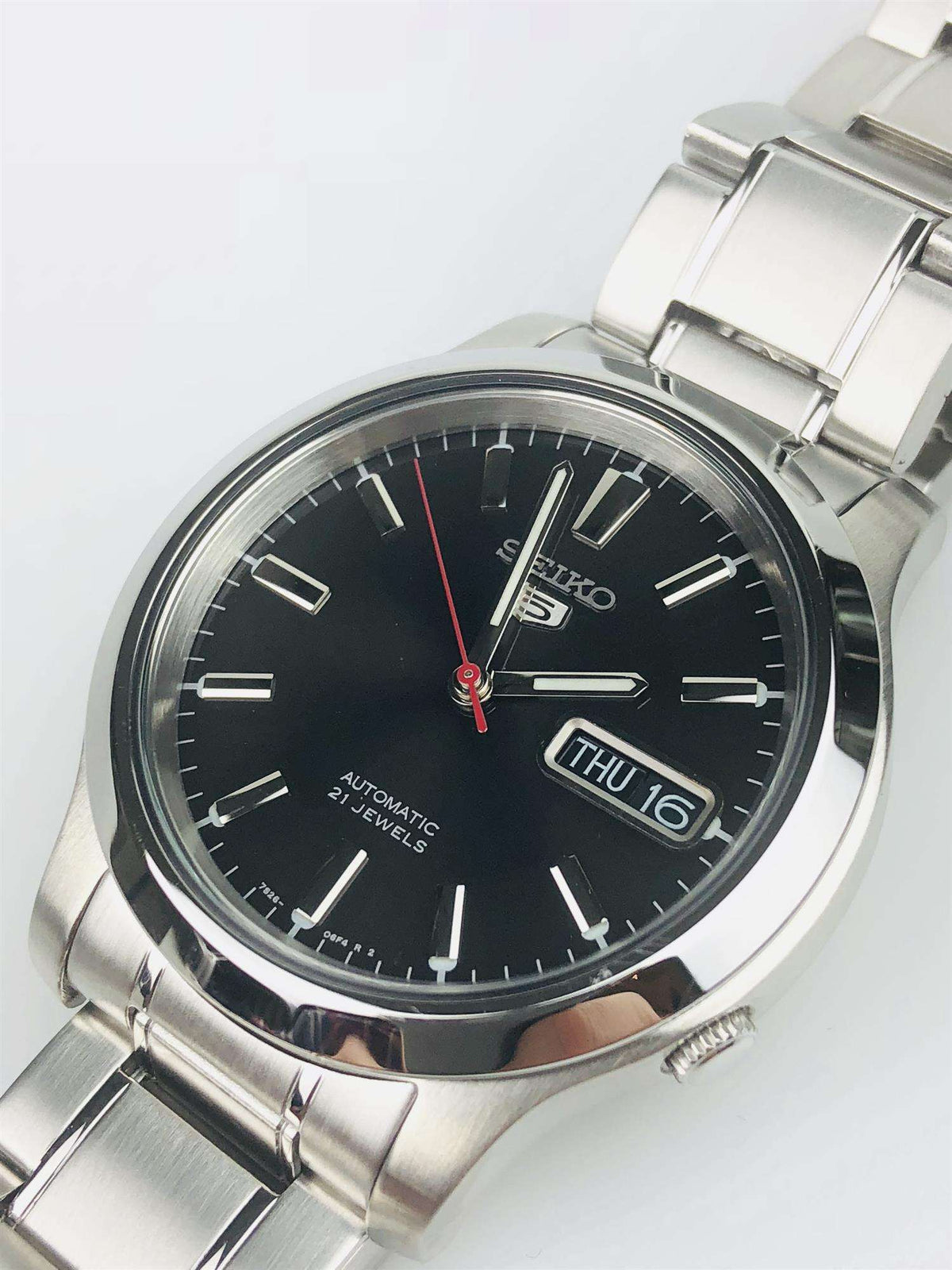 Men's stainless steel automatic watch with black dial and metal bracelet, THU 16 date window.