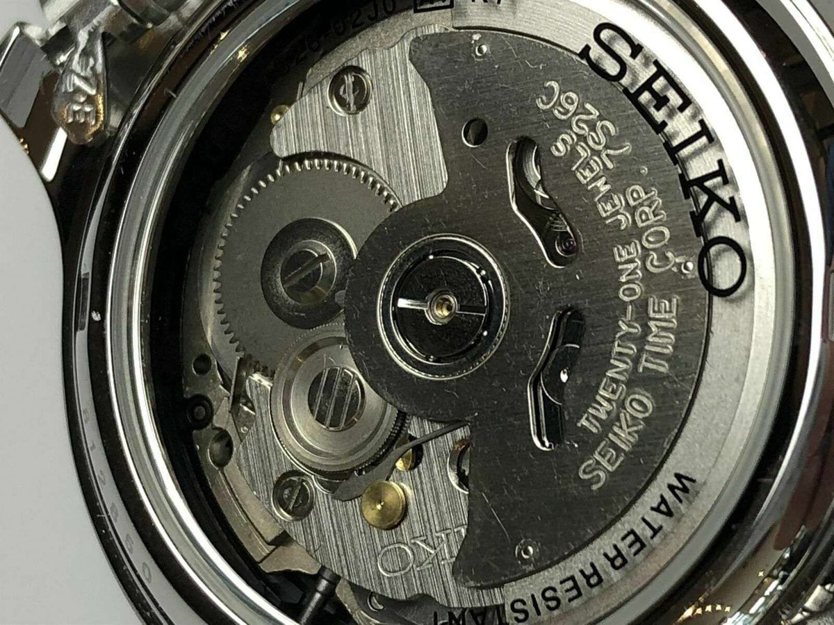 Seiko automatic watch case back close-up with engraved steel movement parts