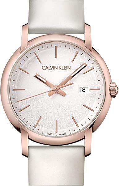 Ladies watch close-up front: white leather strap, rose-gold case, silver dial with date 8