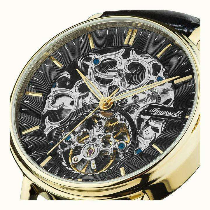 Ingersoll 1892 watch close-up: black dial with skeleton automatic movement, gold hour markers
