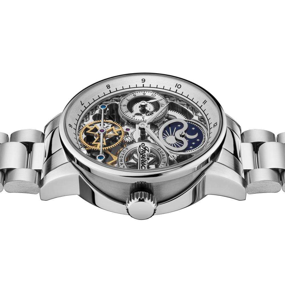Silver automatic wristwatch from above, skeleton dial showing gears and moon detail