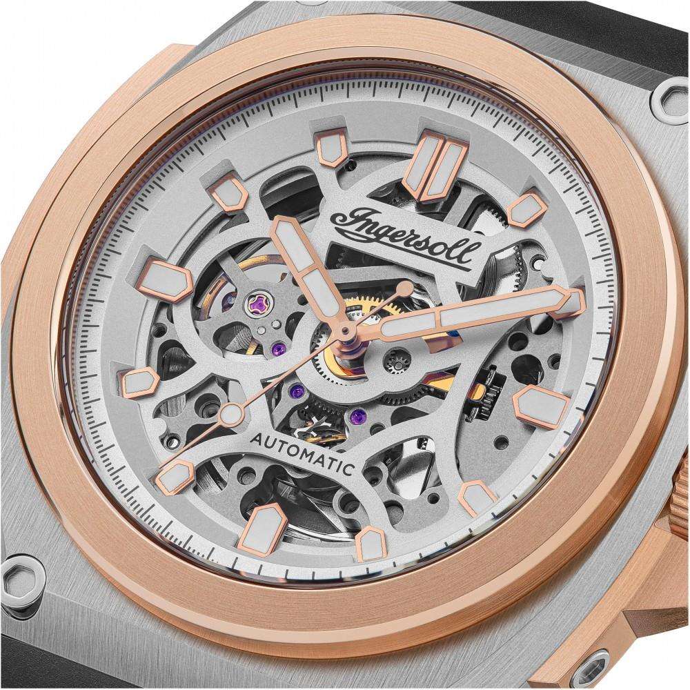 Men's automatic skeleton watch close-up, silver dial with rose-gold hands and markers