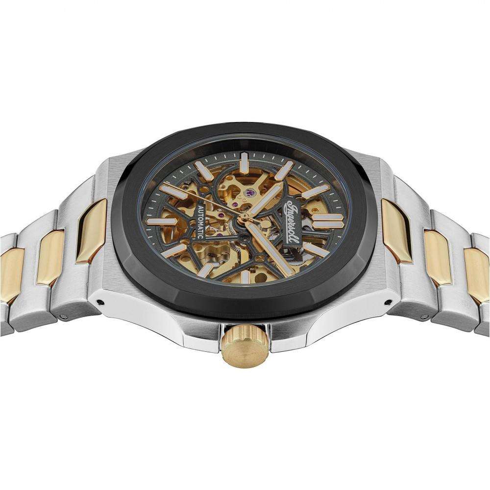 Two-tone automatic watch case with black bezel ring, gold accents, and stainless steel bracelet.