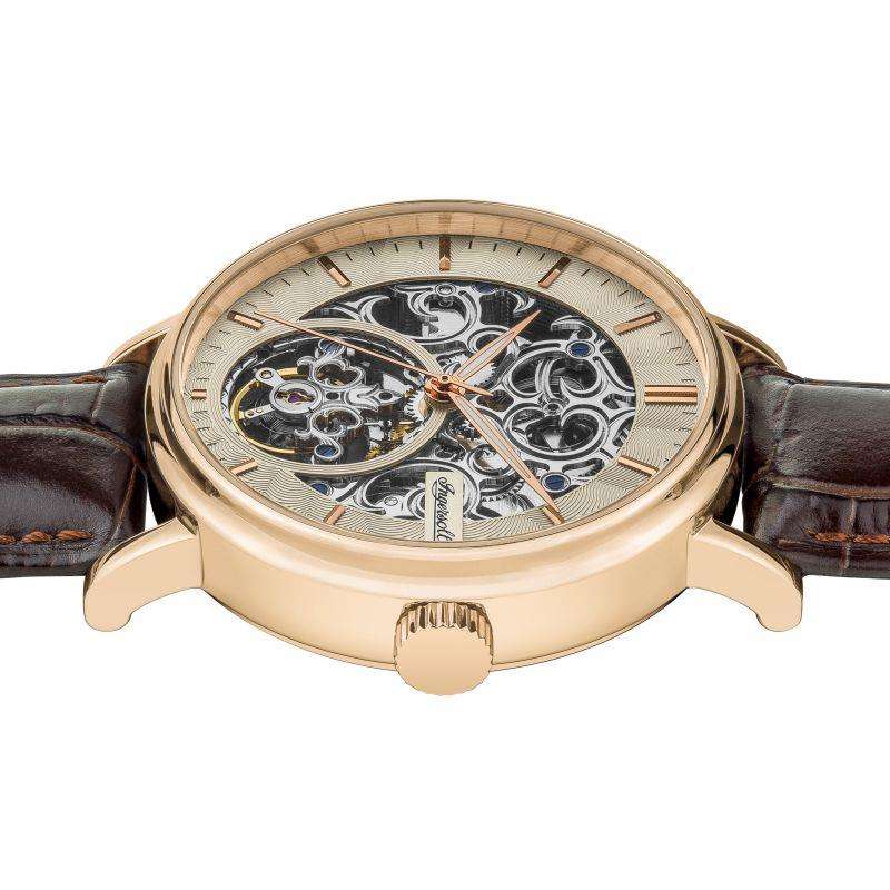 Men's Ingersoll automatic skeleton watch showing gold-tone case and brown leather strap