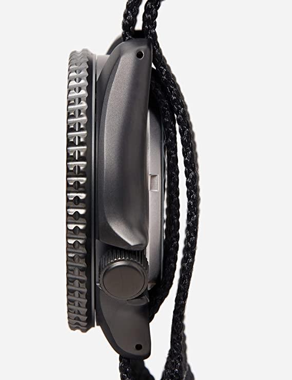 Side profile view of Seiko 5 Sports black nylon strap mens watch, displaying the unidirectional bezel and the secure pass-through design of the nylon strap