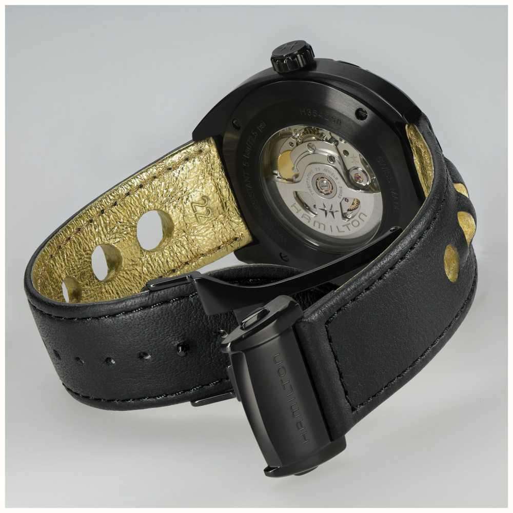 Hamilton watch caseback view with black leather strap and open case with movement visible