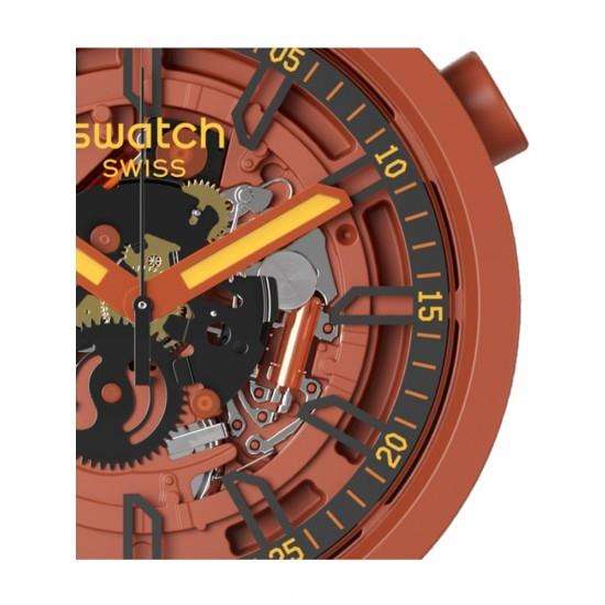 Close-up skeleton dial watch with open-heart cutouts, orange hands, black minute track, rust case
