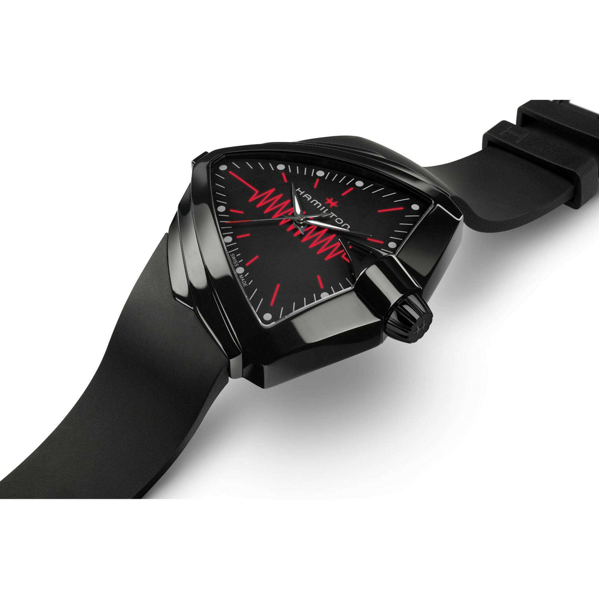 Angular black watch case with black dial, red accents, and black rubber strap