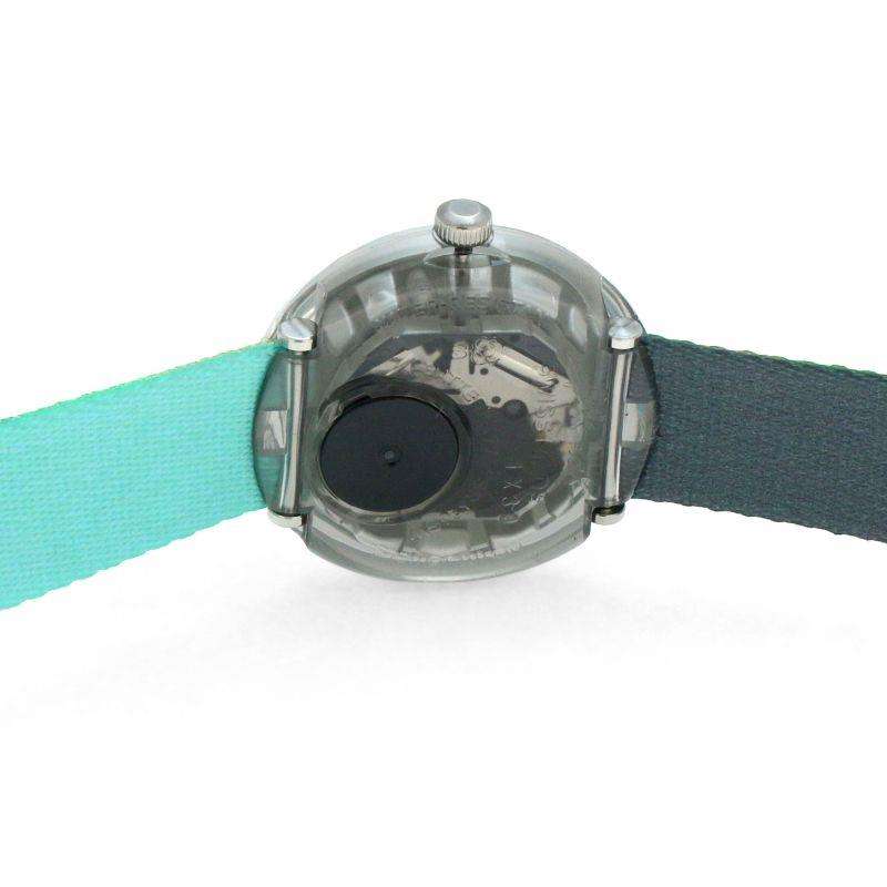 Flik Flak kids wristwatch back view, round clear case with teal fabric strap