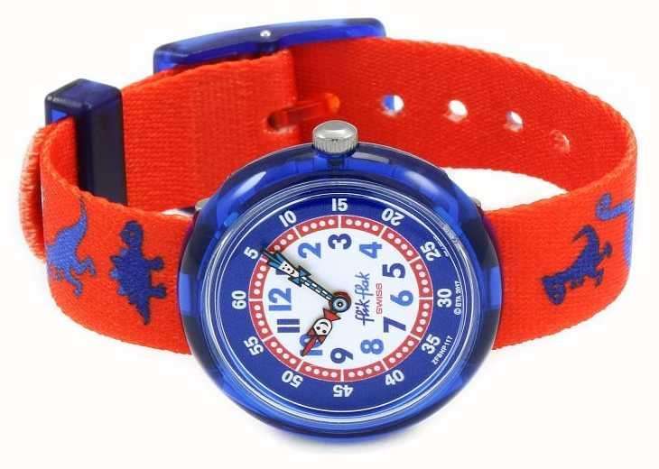 Round blue children's watch dial with red textile strap and dinosaur print, fixed crown