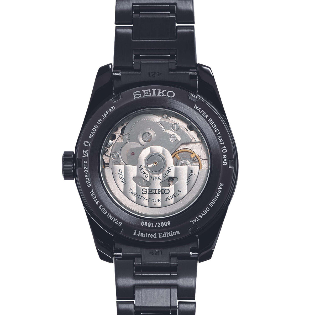 Men's black caseback automatic watch with visible mechanical movement and text