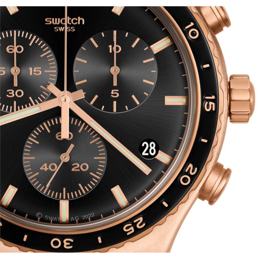 Swatch chronograph-style watch close-up with black dial and rose-gold markers